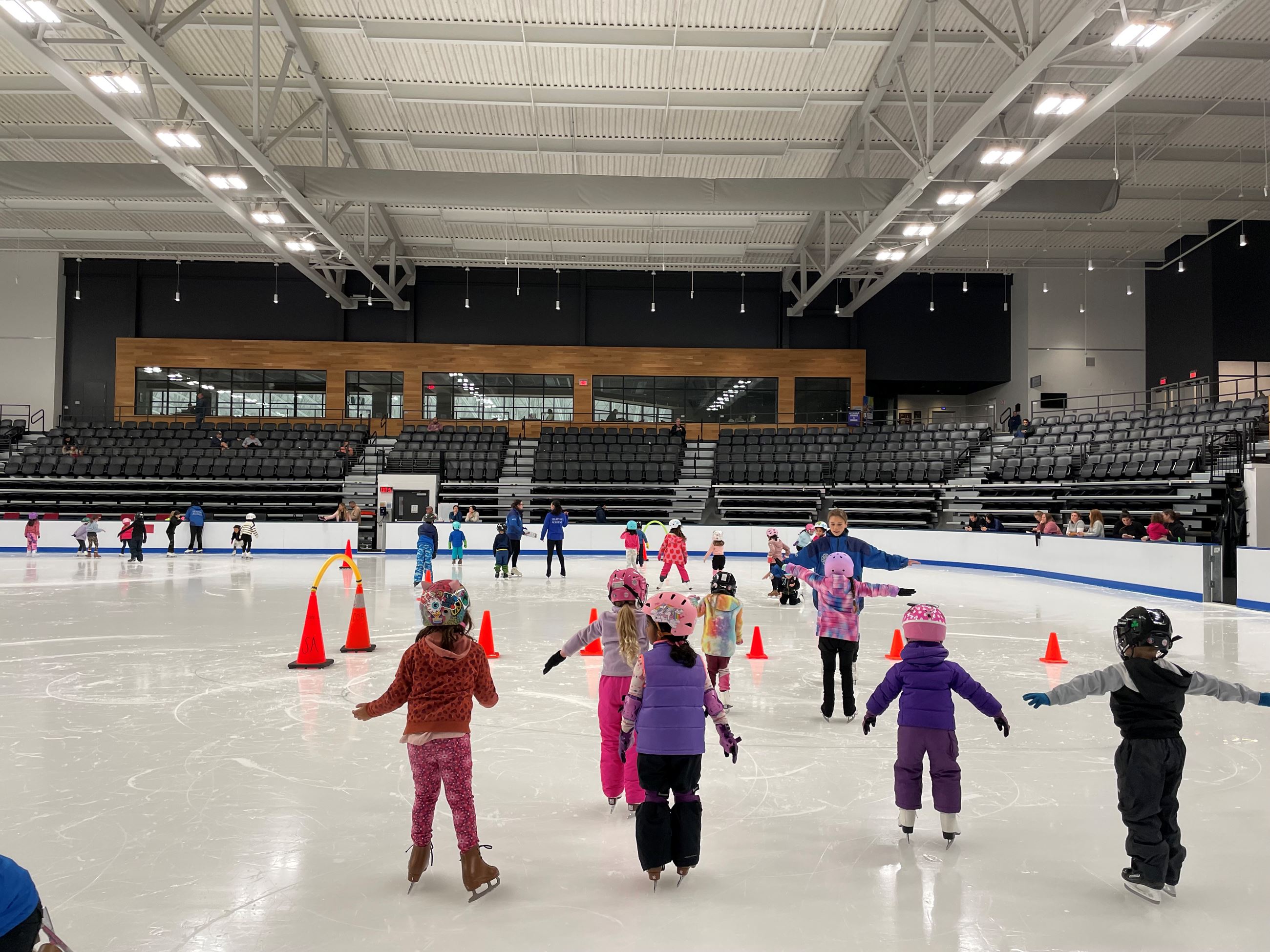 Photo of children practicing their balance while ice skating